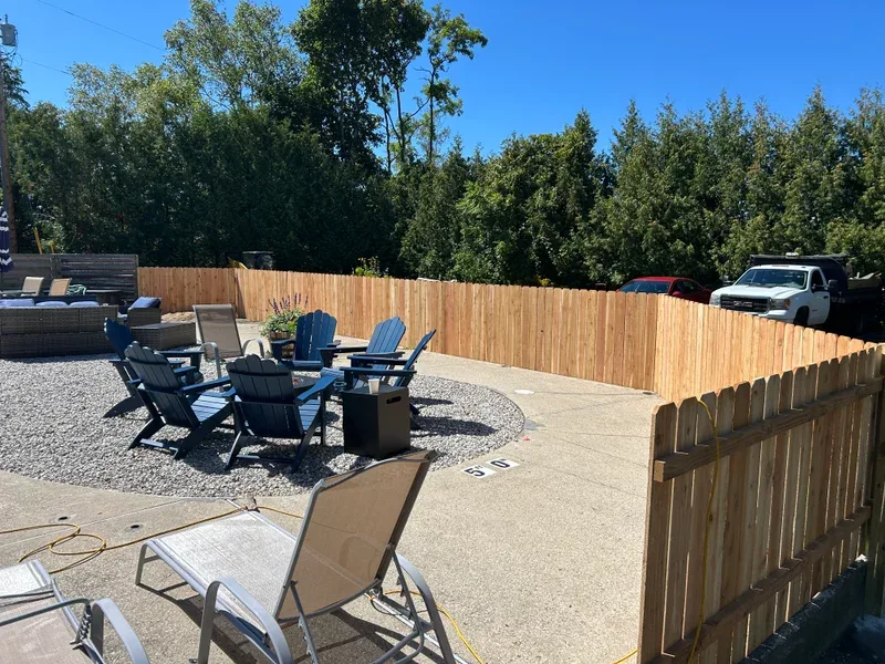 Patio with a new cedar privacy fence and fire pit seating